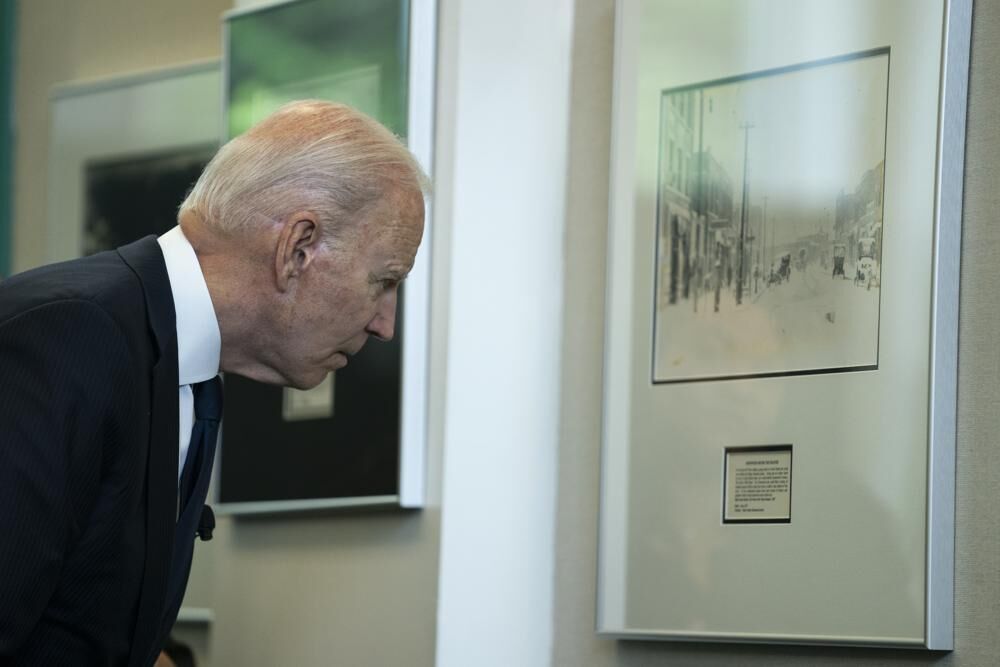 biden looking at photo